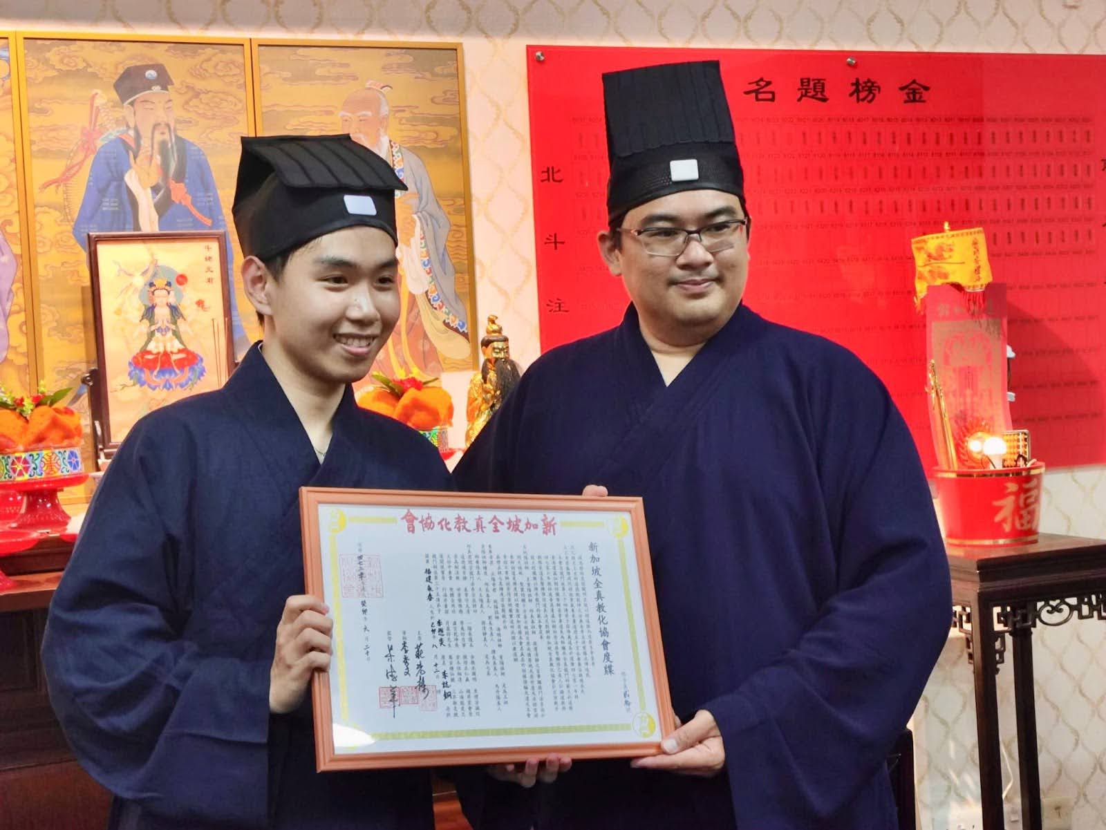 Chee Tong holds his ordainment certificate at his ceremony. (Photo credit: Lee Chee Tong)