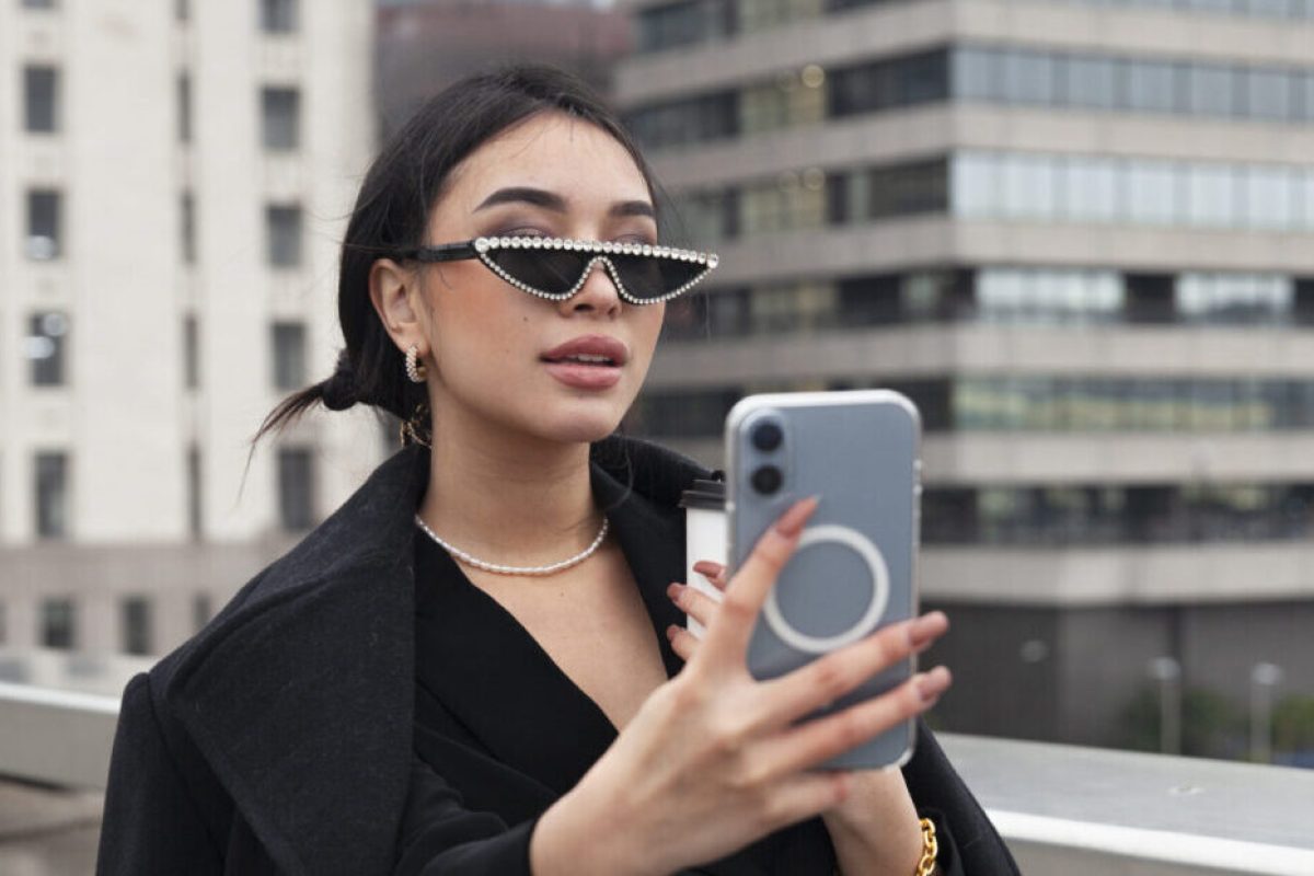 influencer-taking-selfie-using-her-smartphone-bridge